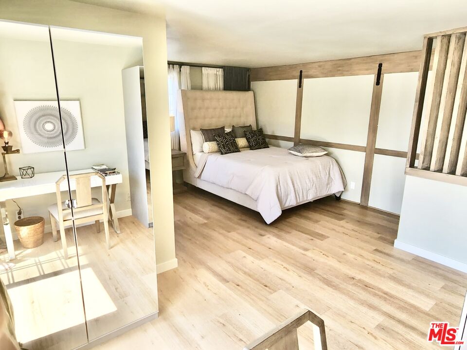 336 Highland Drive Oxnard, CA 93035 - Photo 7 of 25 a bedroom with a balcony a bed and walk in closet