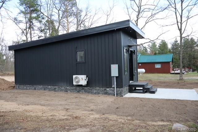 1545 South La Chance Road Lake City, MI 49651 - Photo 3 of 51 View of home's exterior featuring an ac unit