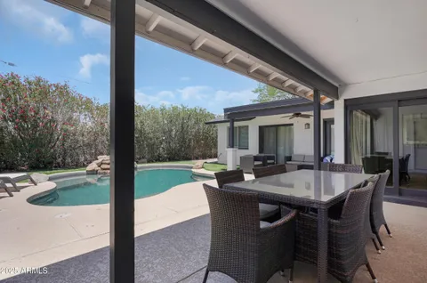 a outdoor dining space with furniture and yard