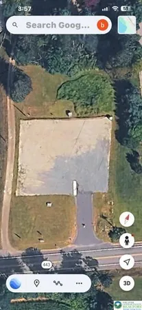 an aerial view of a residential houses with outdoor space