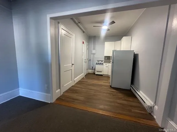 a bathroom with a toilet sink and shower