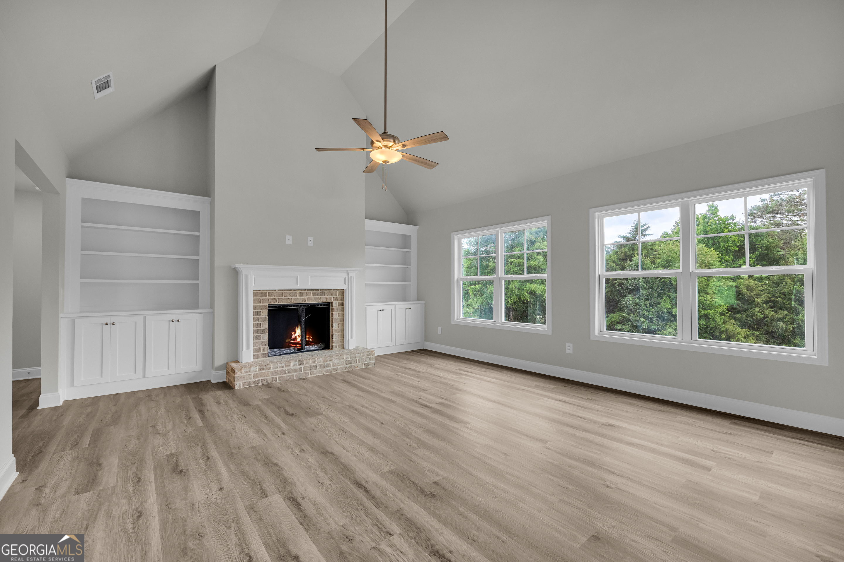 110 Sewell Road Lavonia, GA 30553 - Photo 3 of 73 a view of an empty room with a window and fireplace