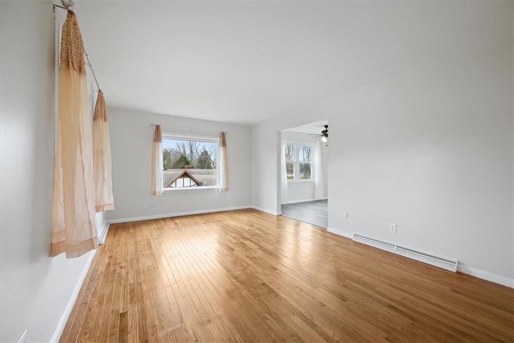 303 Chapin Road New Castle, PA 16105 - Photo 12 of 25 an empty room with wooden floor and windows