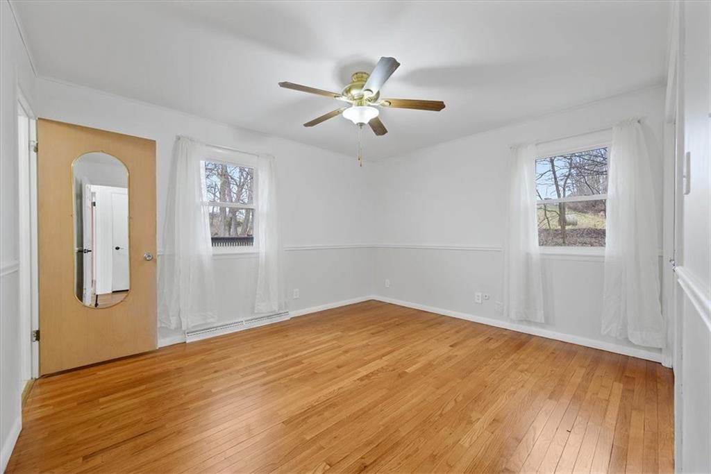 303 Chapin Road New Castle, PA 16105 - Photo 15 of 25 a view of empty room with wooden floor and fan