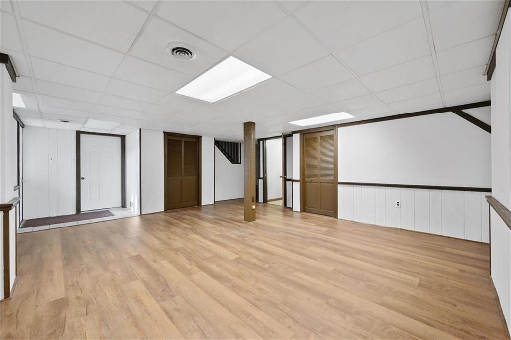 303 Chapin Road New Castle, PA 16105 - Photo 18 of 25 a view of an empty room with wooden floor
