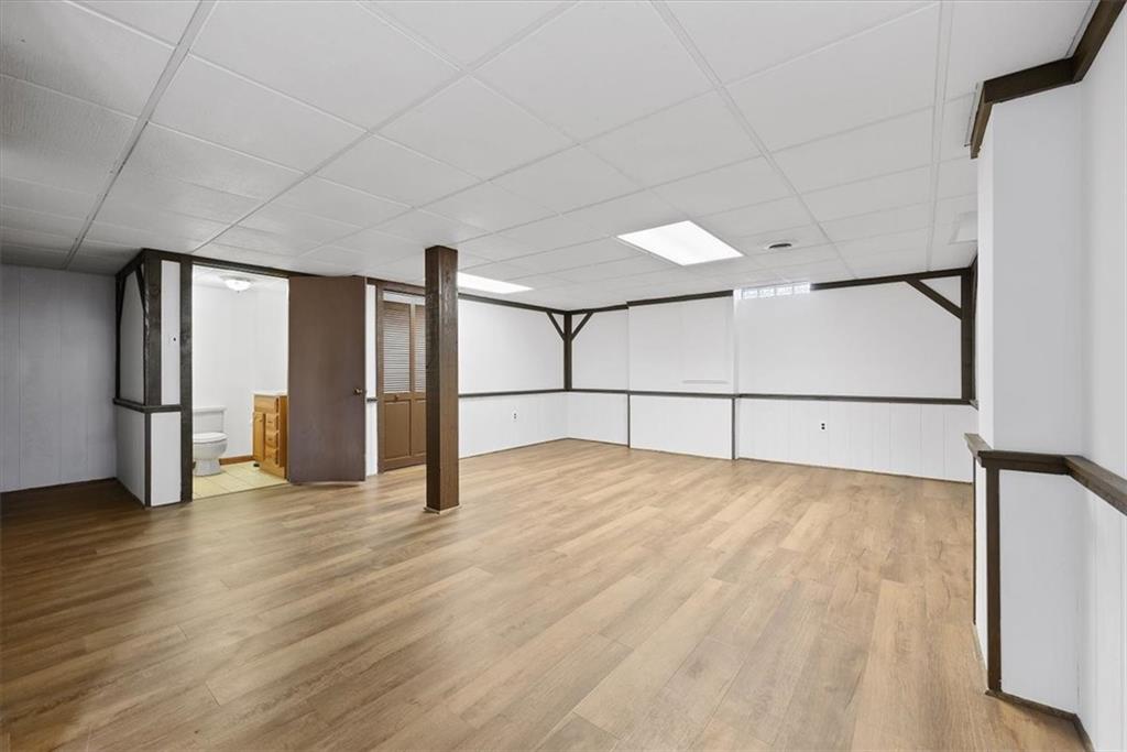 303 Chapin Road New Castle, PA 16105 - Photo 19 of 25 a view of an empty room with wooden floor
