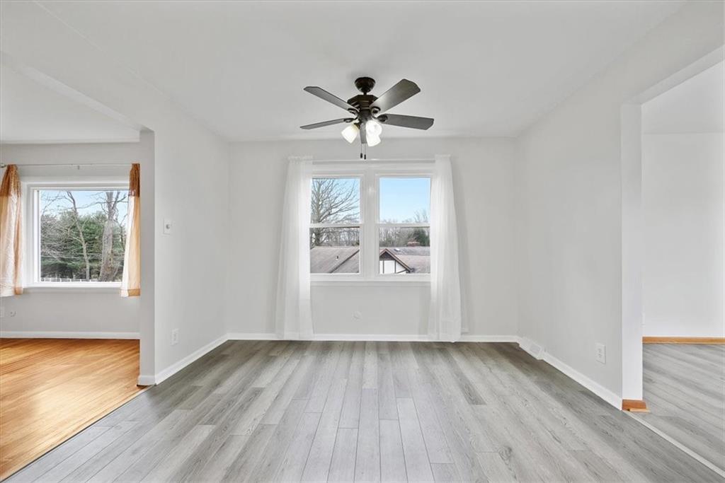 303 Chapin Road New Castle, PA 16105 - Photo 7 of 25 wooden floor in an empty room with a window