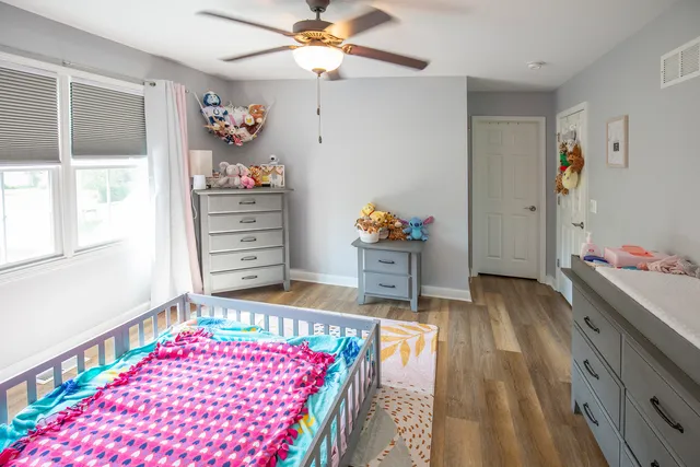 a bedroom with a bed and window