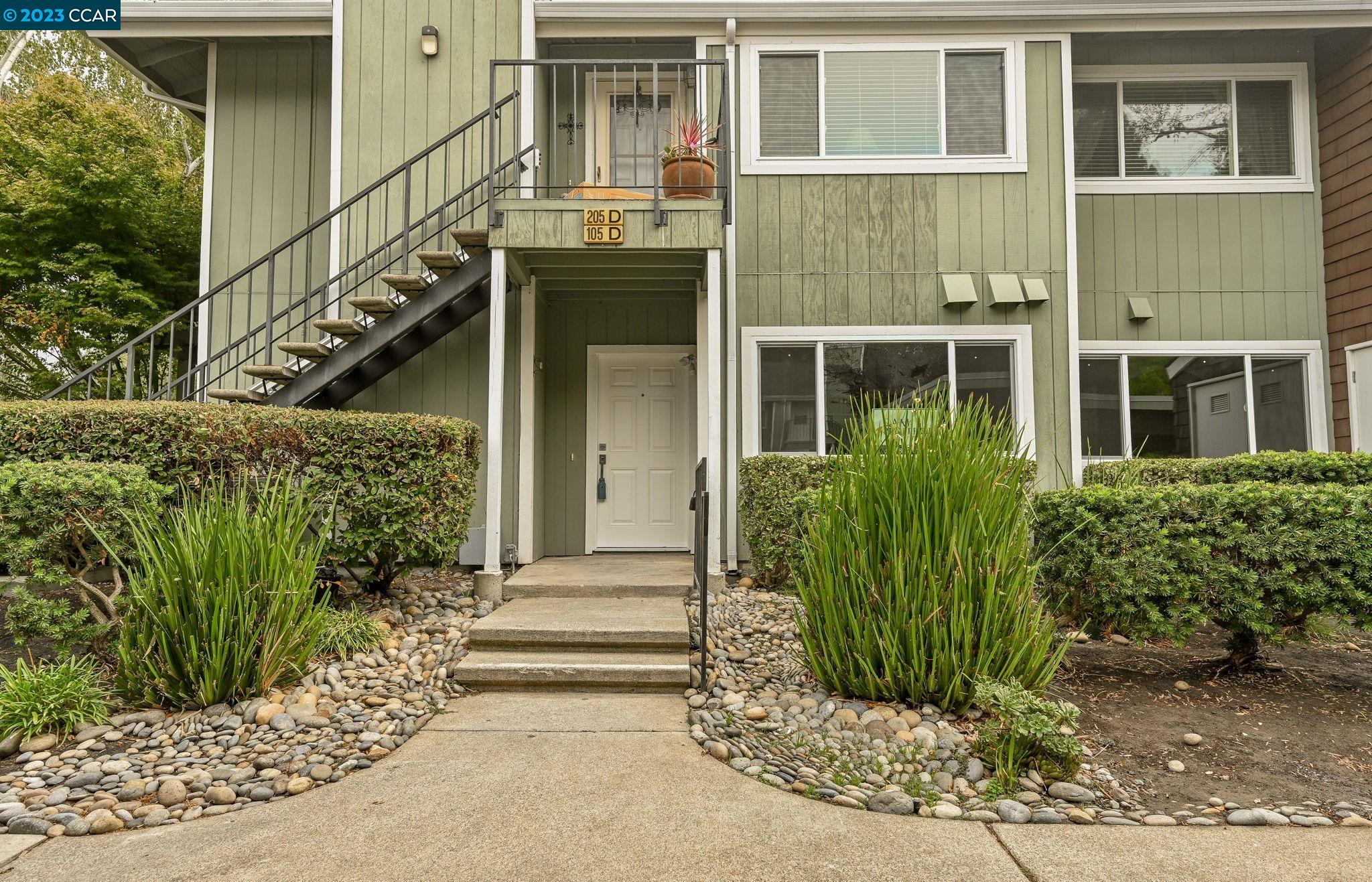 105 Compton Circle, Unit D San Ramon, CA 94583 - Photo 1 of 1 a front view of a house with a garden