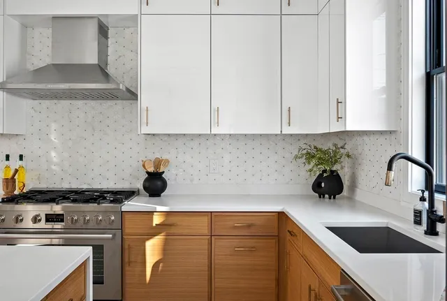 a kitchen with a sink and cabinets