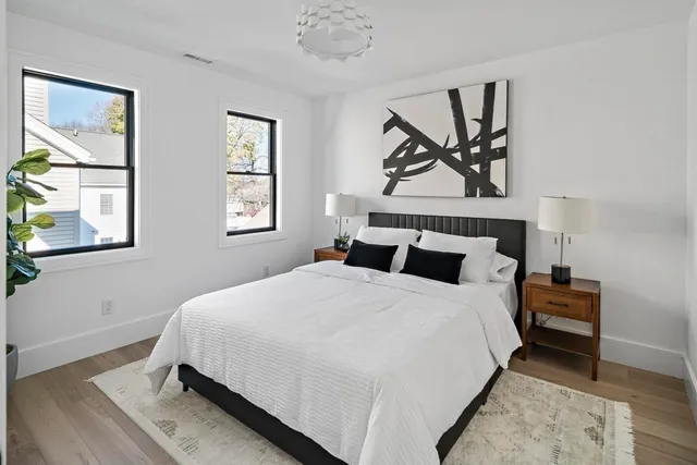 a bedroom with a bed and a table in it