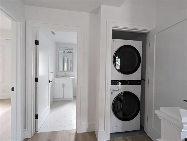 a view of a hallway with washer and dryer