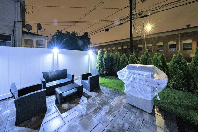 a view of a patio with a yard