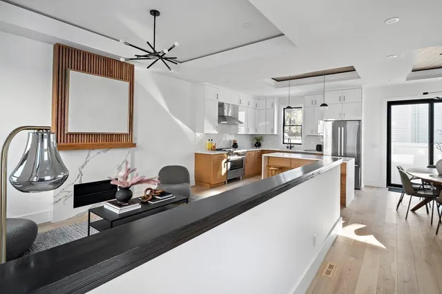 a kitchen with a sink appliances and a counter top space