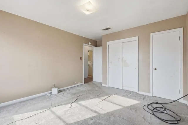 a view of a room with closet and wooden floor