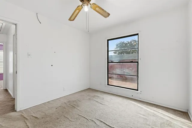 a view of a house with large trees