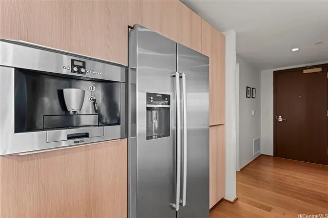 a kitchen with stainless steel appliances a refrigerator and a sink