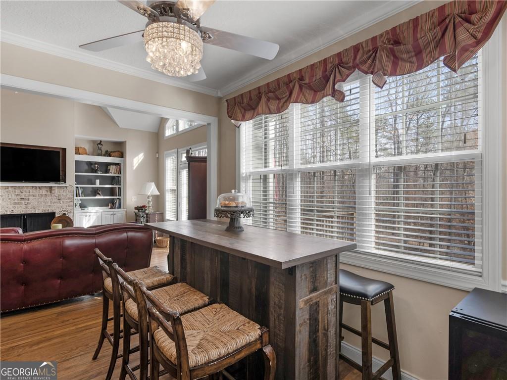 355 Parker Road Covington, GA 30014 - Photo 27 of 60 a view of a dining room with furniture window and wooden floor