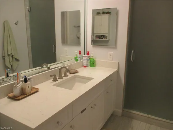 a bathroom with a sink and a mirror