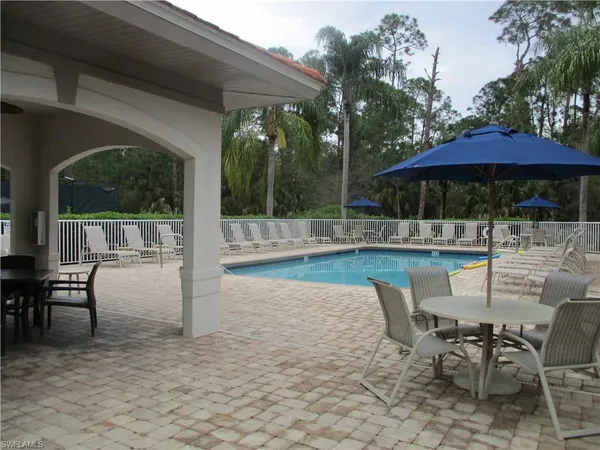 a view of a balcony with table and chairs
