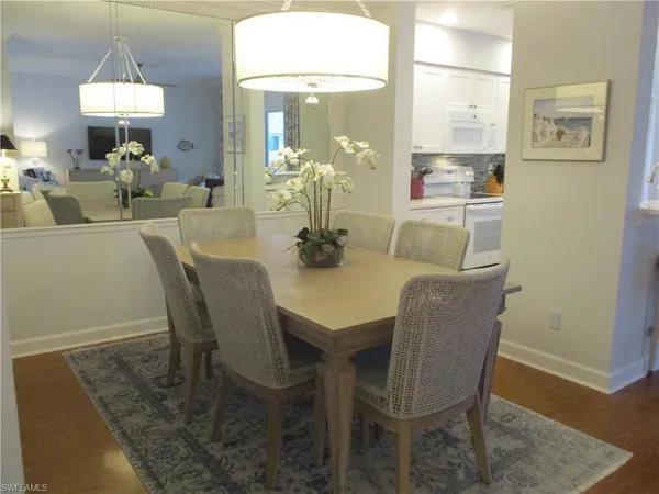 a dining room with furniture and window