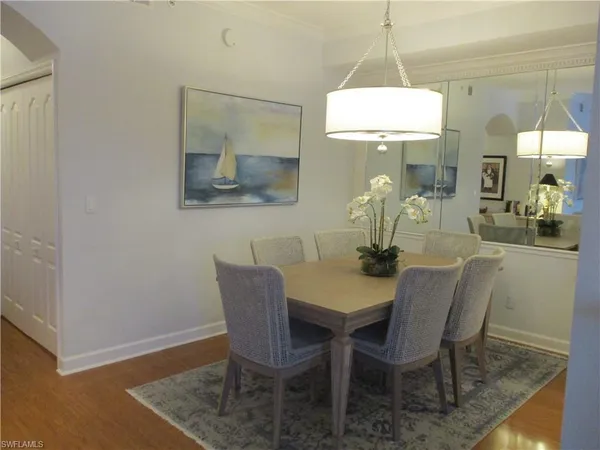 a dining room with furniture and window