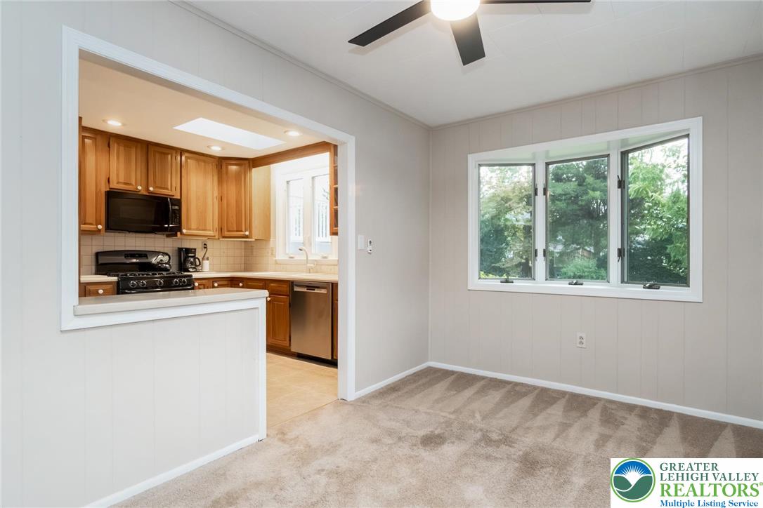 898 Walnut Road Warminster, PA 18974 - Photo 12 of 47 a kitchen with stainless steel appliances a stove sink microwave and refrigerator