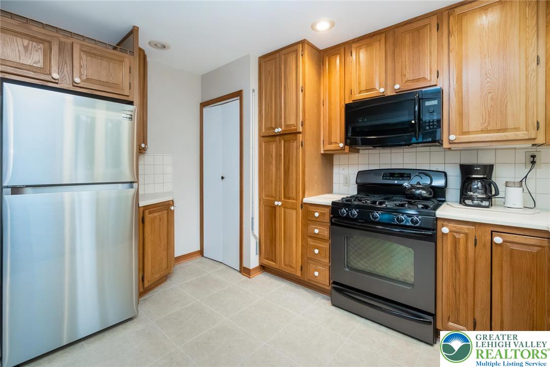 898 Walnut Road Warminster, PA 18974 - Photo 14 of 47 a kitchen with stainless steel appliances granite countertop a refrigerator stove and microwave
