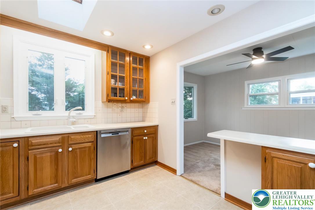 898 Walnut Road Warminster, PA 18974 - Photo 16 of 47 a view of a kitchen with wooden floor and windows