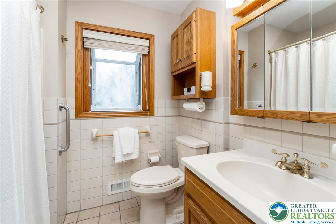 898 Walnut Road Warminster, PA 18974 - Photo 24 of 47 a bathroom with a sink a toilet and mirror