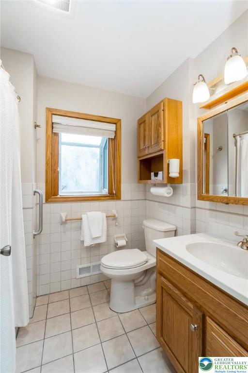 898 Walnut Road Warminster, PA 18974 - Photo 25 of 47 a bathroom with a sink a toilet and mirror