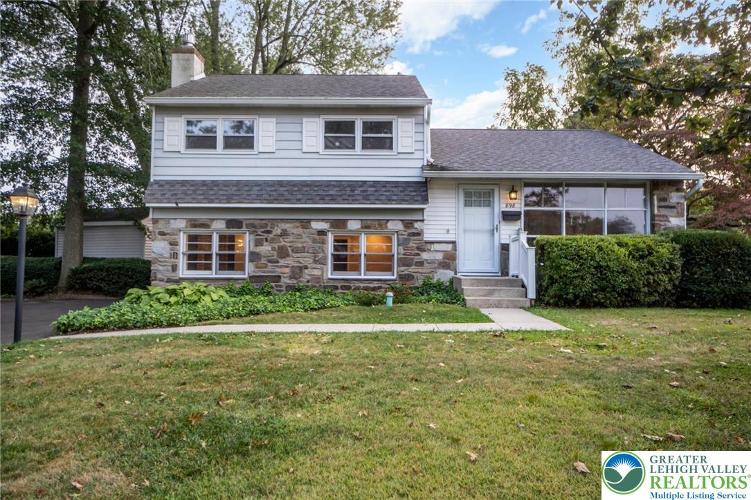 898 Walnut Road Warminster, PA 18974 - Photo 4 of 47 a front view of a house with a yard