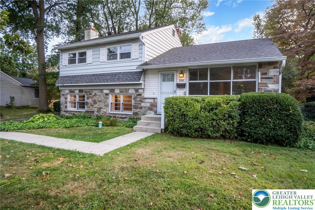 898 Walnut Road Warminster, PA 18974 - Photo 5 of 47 a front view of a house with a yard