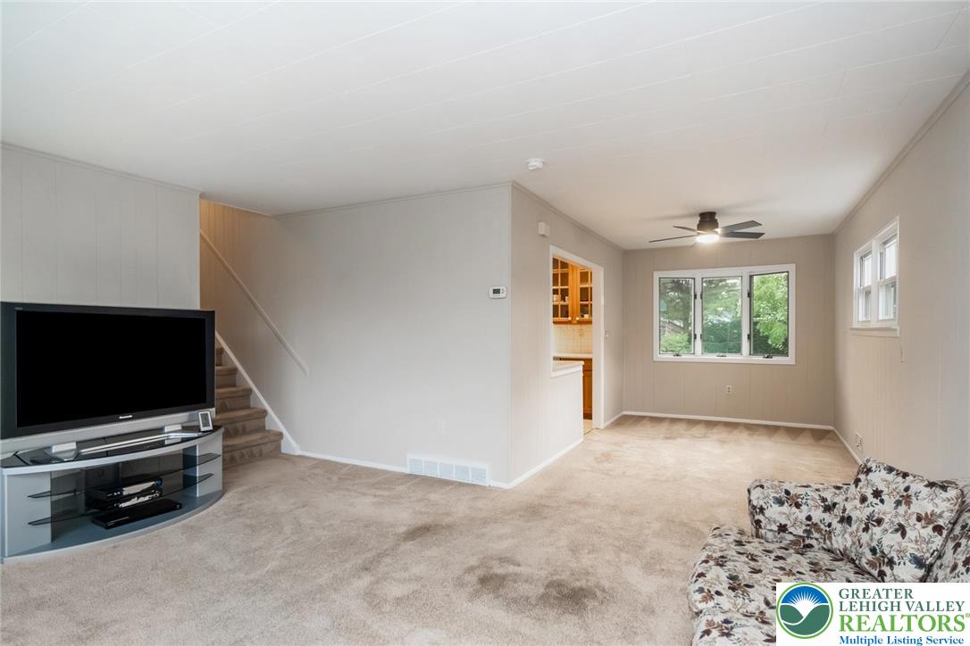 898 Walnut Road Warminster, PA 18974 - Photo 8 of 47 a view of a livingroom with furniture and a flat screen tv