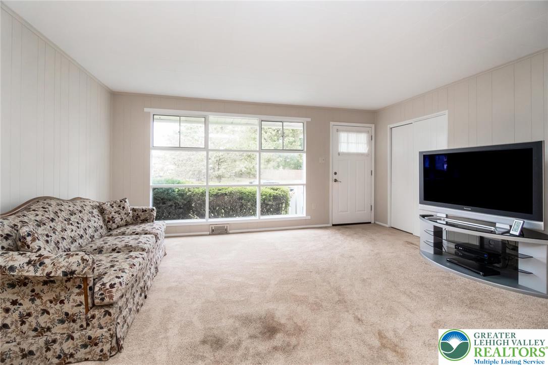 898 Walnut Road Warminster, PA 18974 - Photo 9 of 47 a view of a livingroom with furniture and a flat screen tv