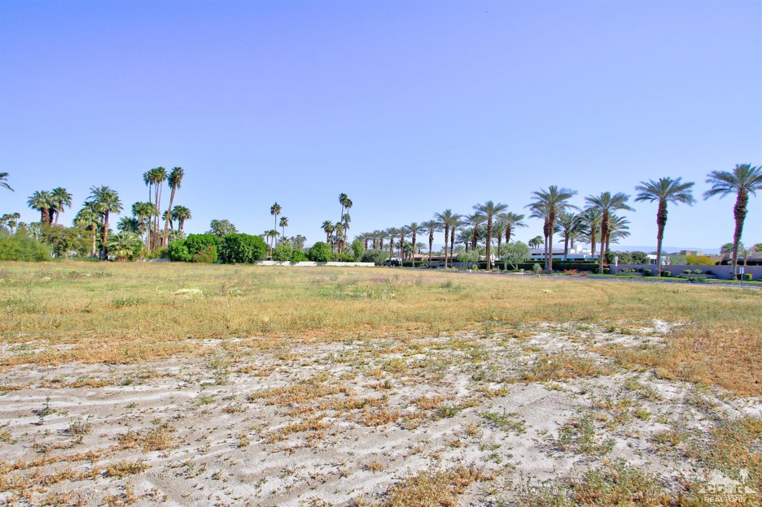 0 Thompson Road Rancho Mirage, CA 92270 - Photo 13 of 18 a view of a lake with houses in the background