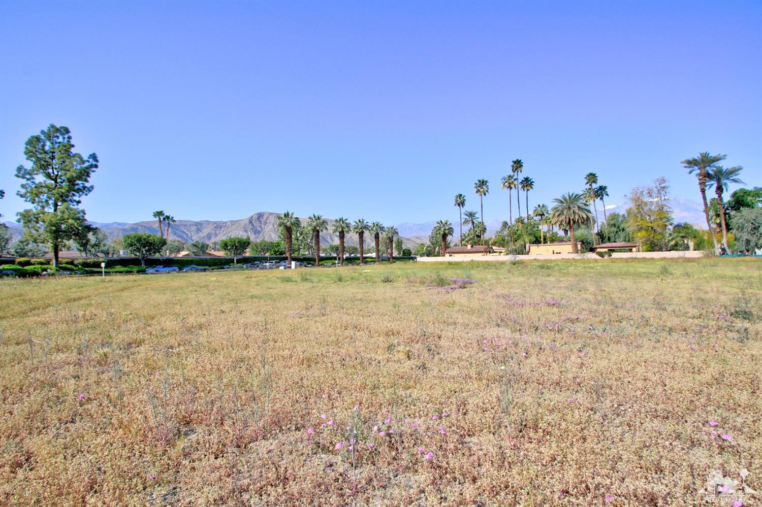 0 Thompson Road Rancho Mirage, CA 92270 - Photo 6 of 18 a view of a lake with houses in the back