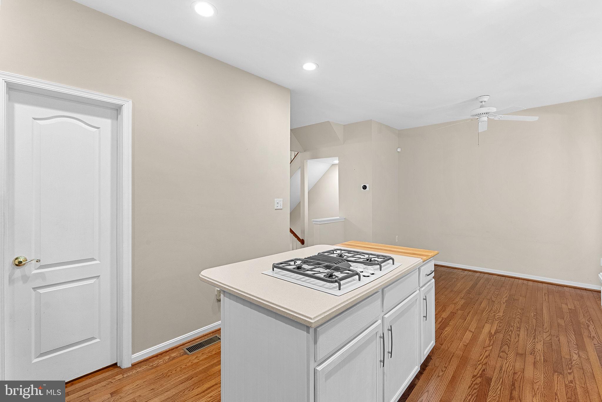 13574 Big Boulder Road Herndon, VA 20171 - Photo 15 of 45 a kitchen with a sink and wooden floor