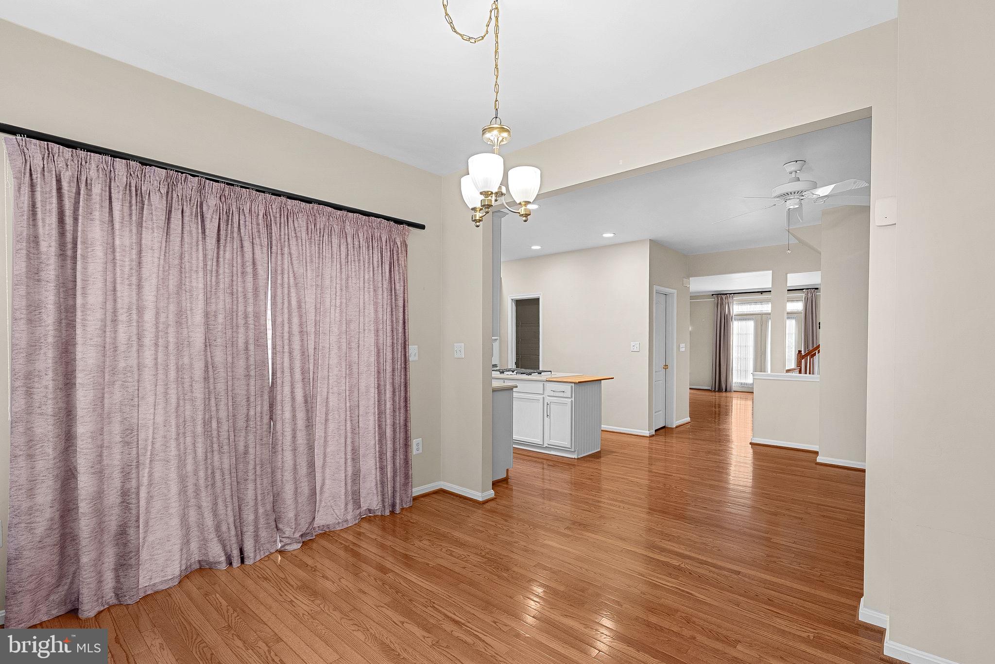 13574 Big Boulder Road Herndon, VA 20171 - Photo 16 of 45 a view of a livingroom with a chandelier furniture and wooden floor