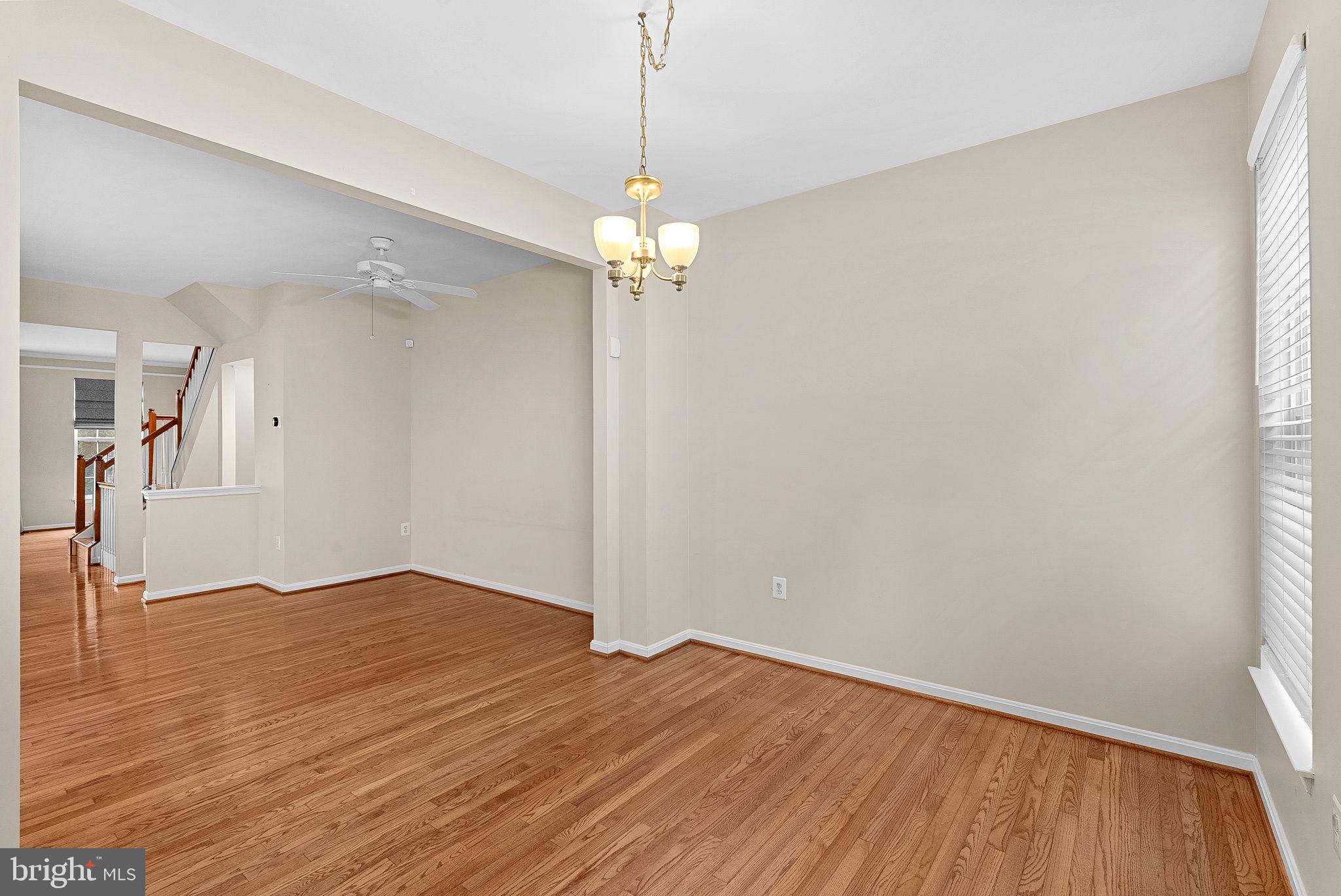 13574 Big Boulder Road Herndon, VA 20171 - Photo 18 of 45 a view of a room with wooden floor chandelier and entryway