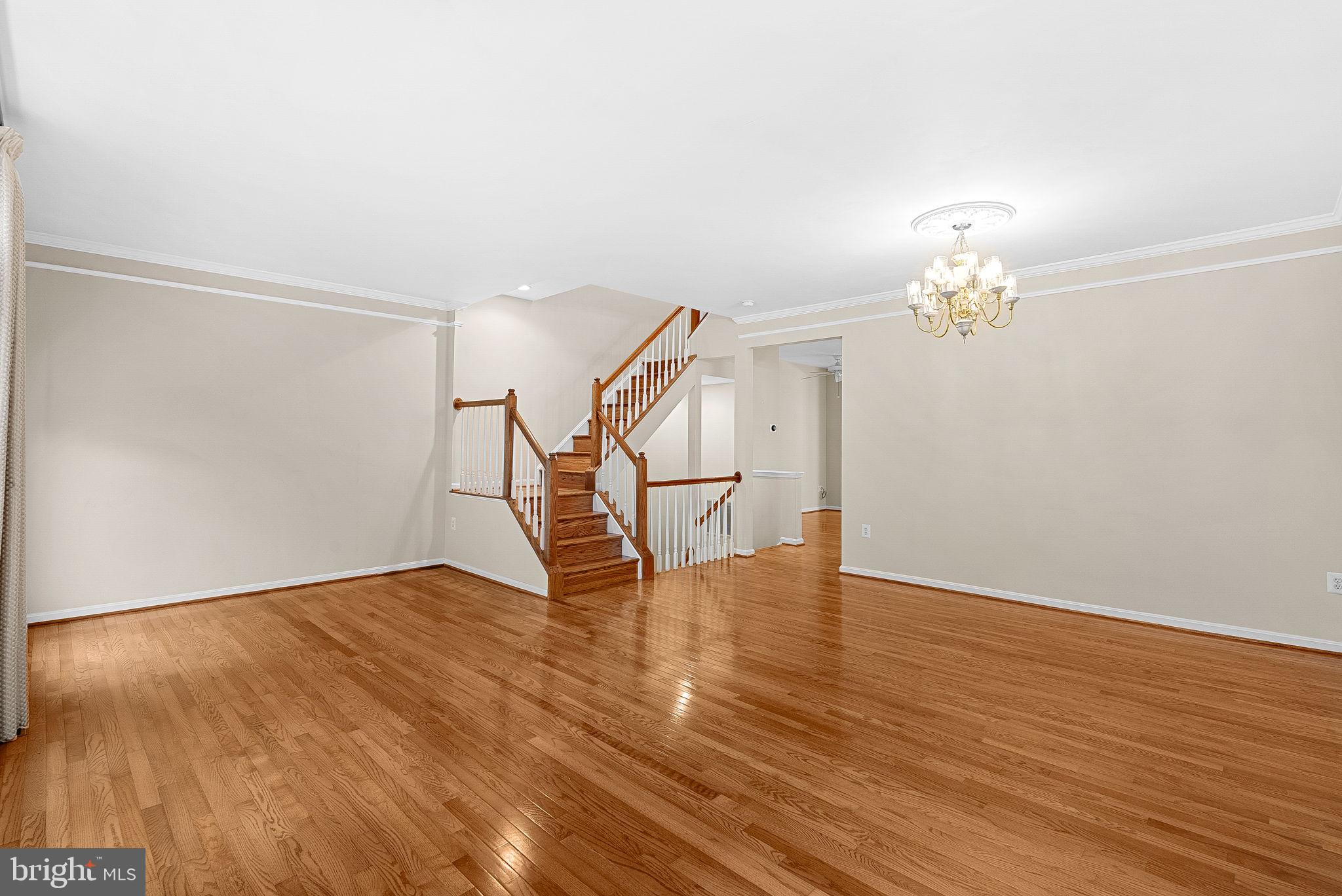 13574 Big Boulder Road Herndon, VA 20171 - Photo 19 of 45 a view of an empty room with wooden floor and a window