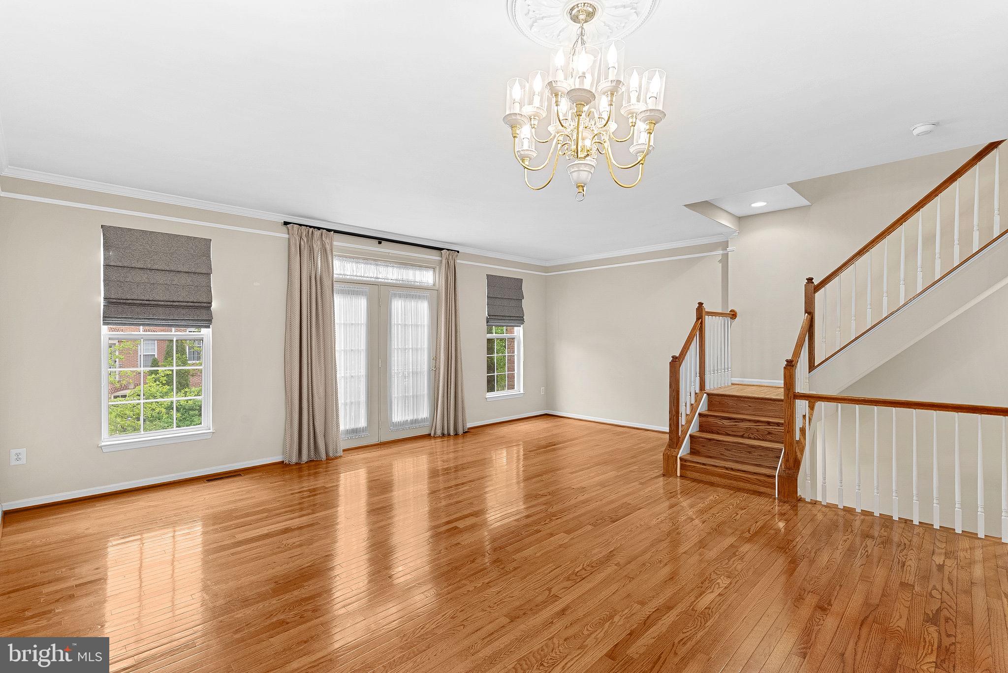 13574 Big Boulder Road Herndon, VA 20171 - Photo 20 of 45 a view of an empty room with wooden floor and a window
