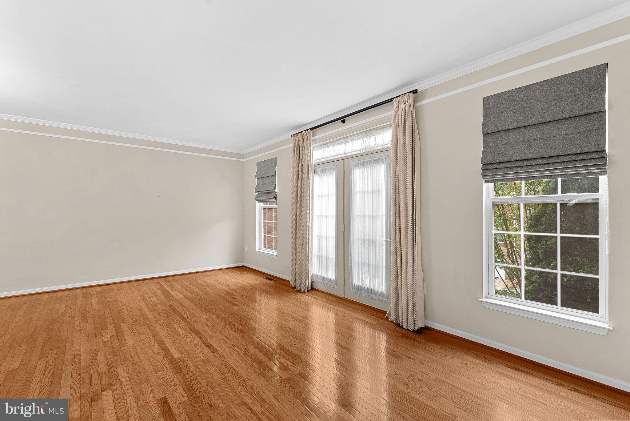 13574 Big Boulder Road Herndon, VA 20171 - Photo 23 of 45 an empty room with wooden floor and windows