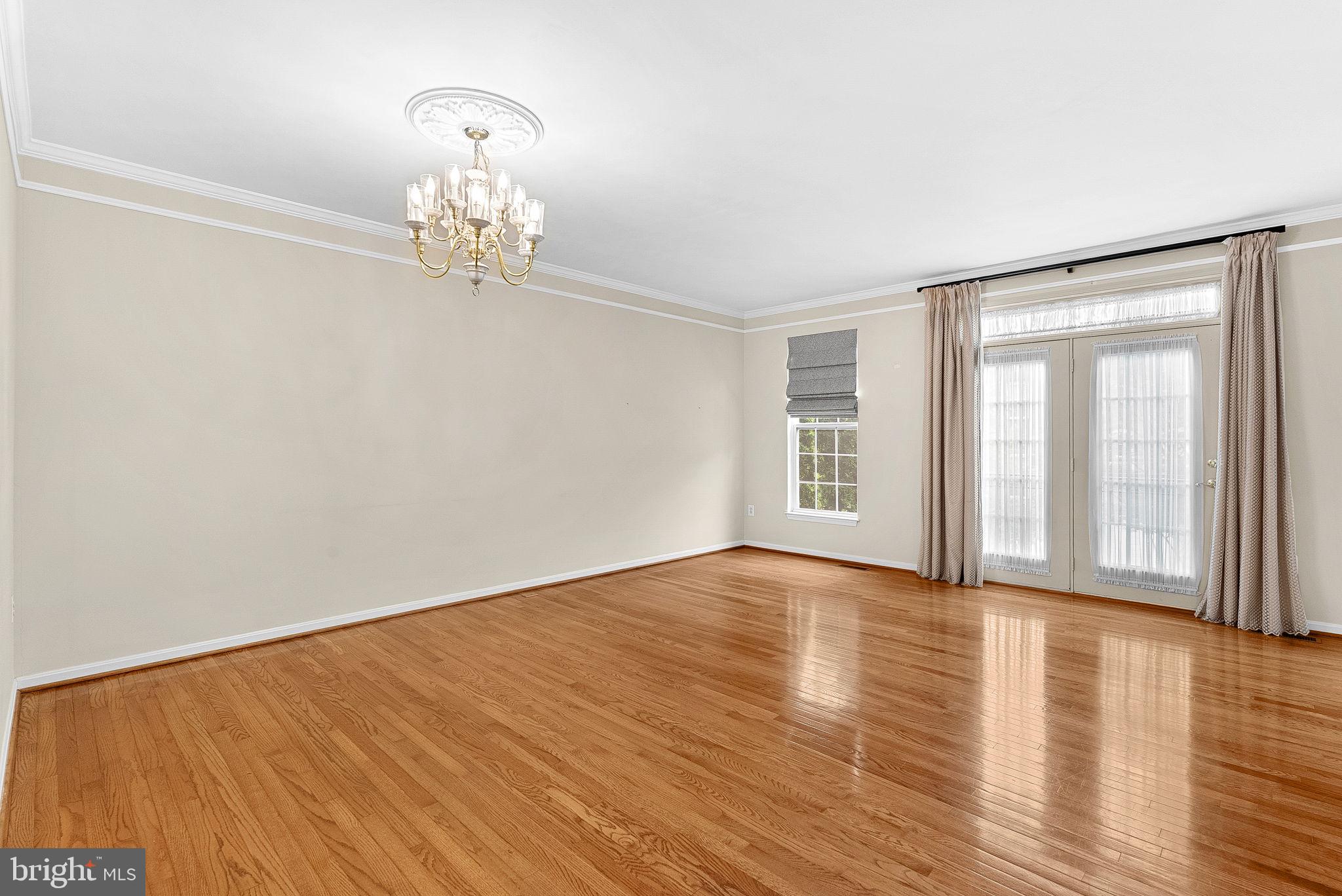 13574 Big Boulder Road Herndon, VA 20171 - Photo 24 of 45 a view of an empty room with wooden floor and a window