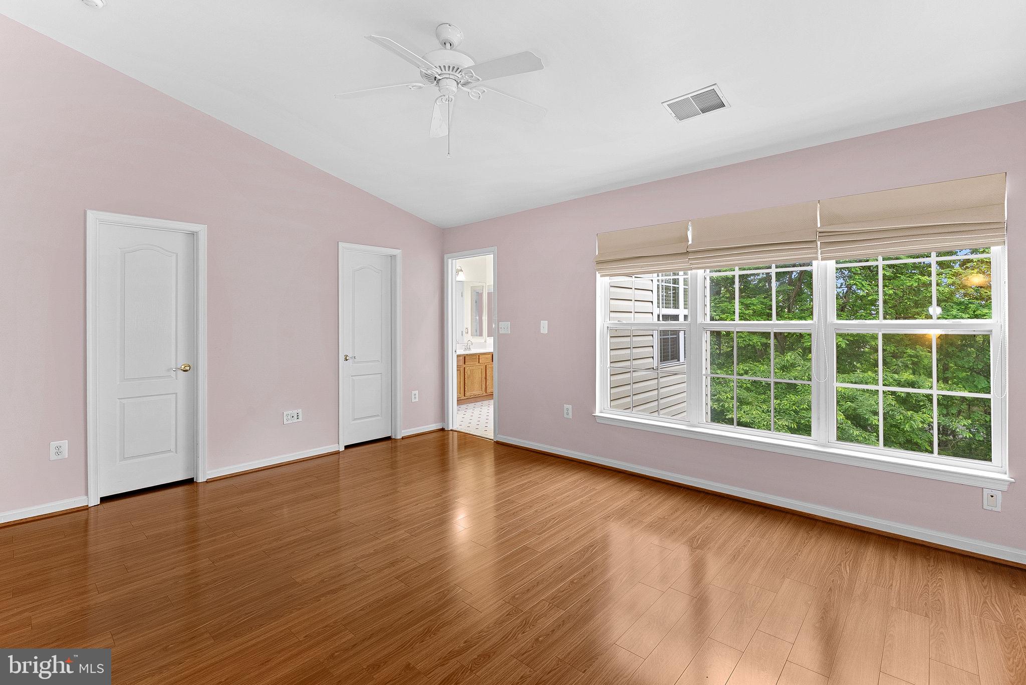 13574 Big Boulder Road Herndon, VA 20171 - Photo 28 of 45 a view of an empty room with wooden floor and a window
