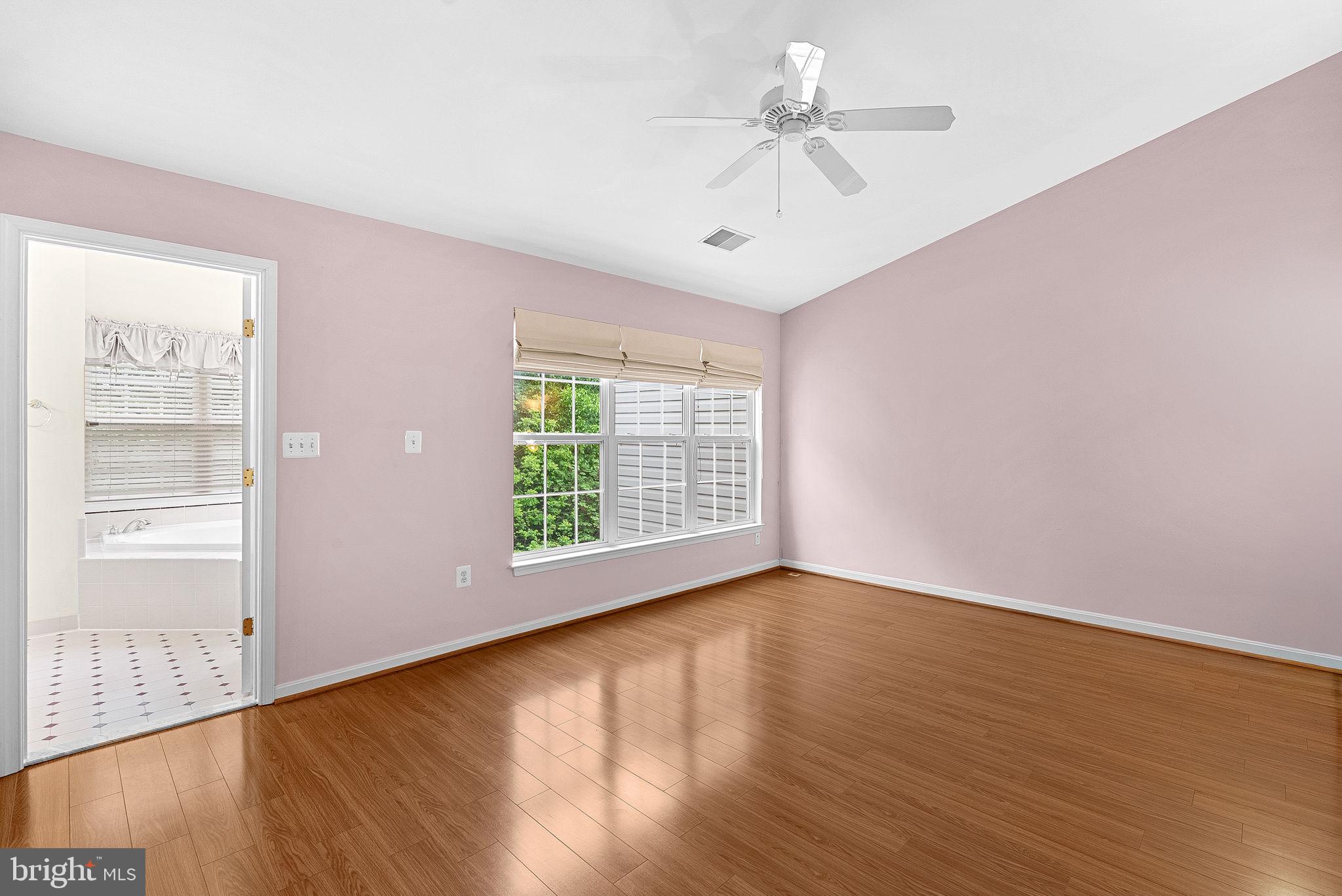 13574 Big Boulder Road Herndon, VA 20171 - Photo 29 of 45 a view of an empty room with wooden floor and a window