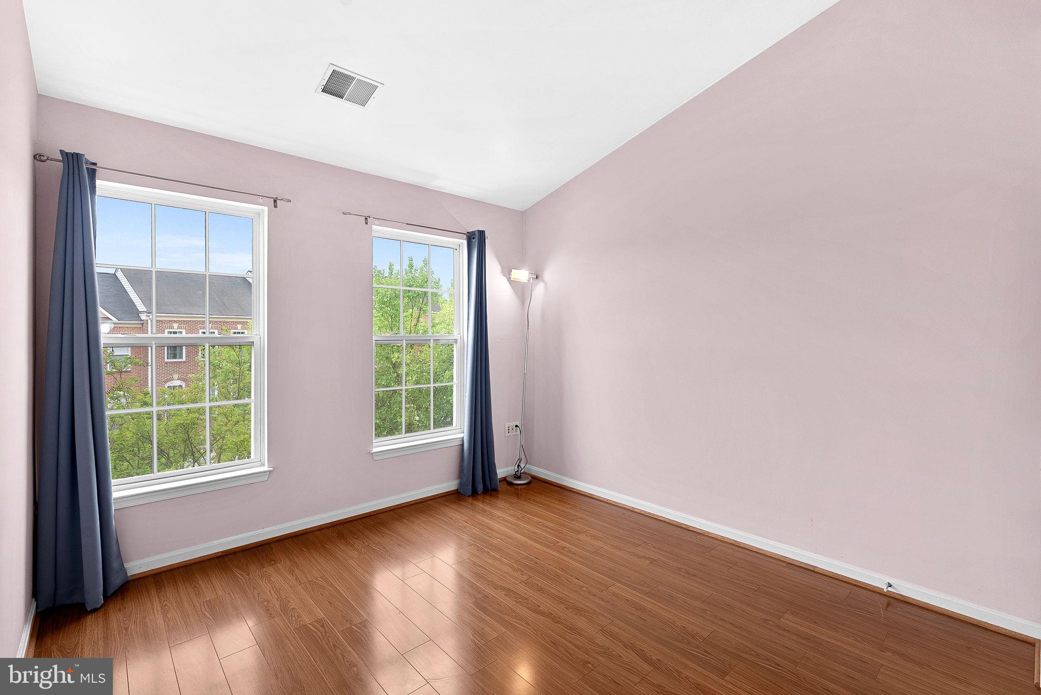 13574 Big Boulder Road Herndon, VA 20171 - Photo 37 of 45 an empty room with wooden floor and windows