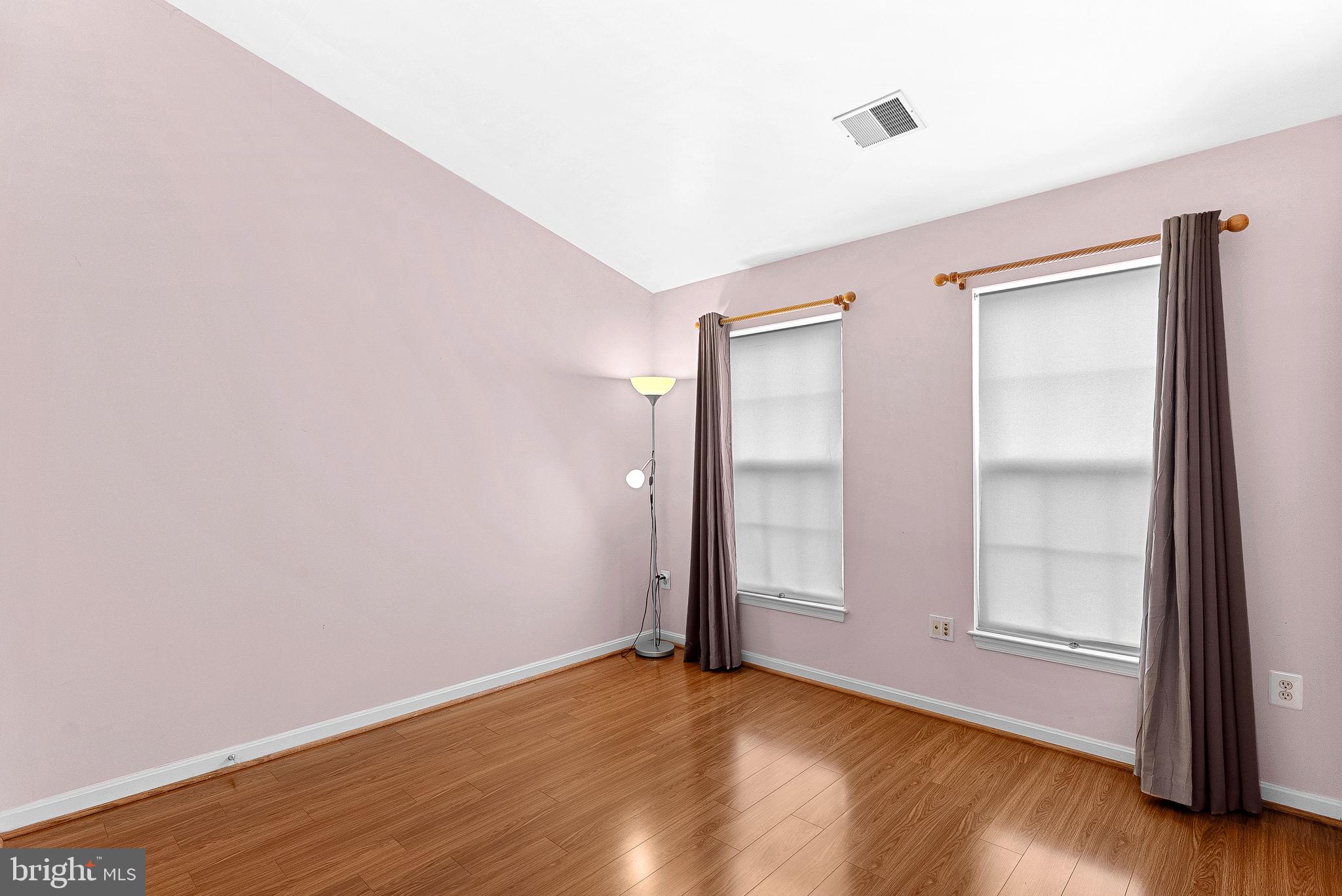 13574 Big Boulder Road Herndon, VA 20171 - Photo 39 of 45 a view of an empty room with wooden floor and a window