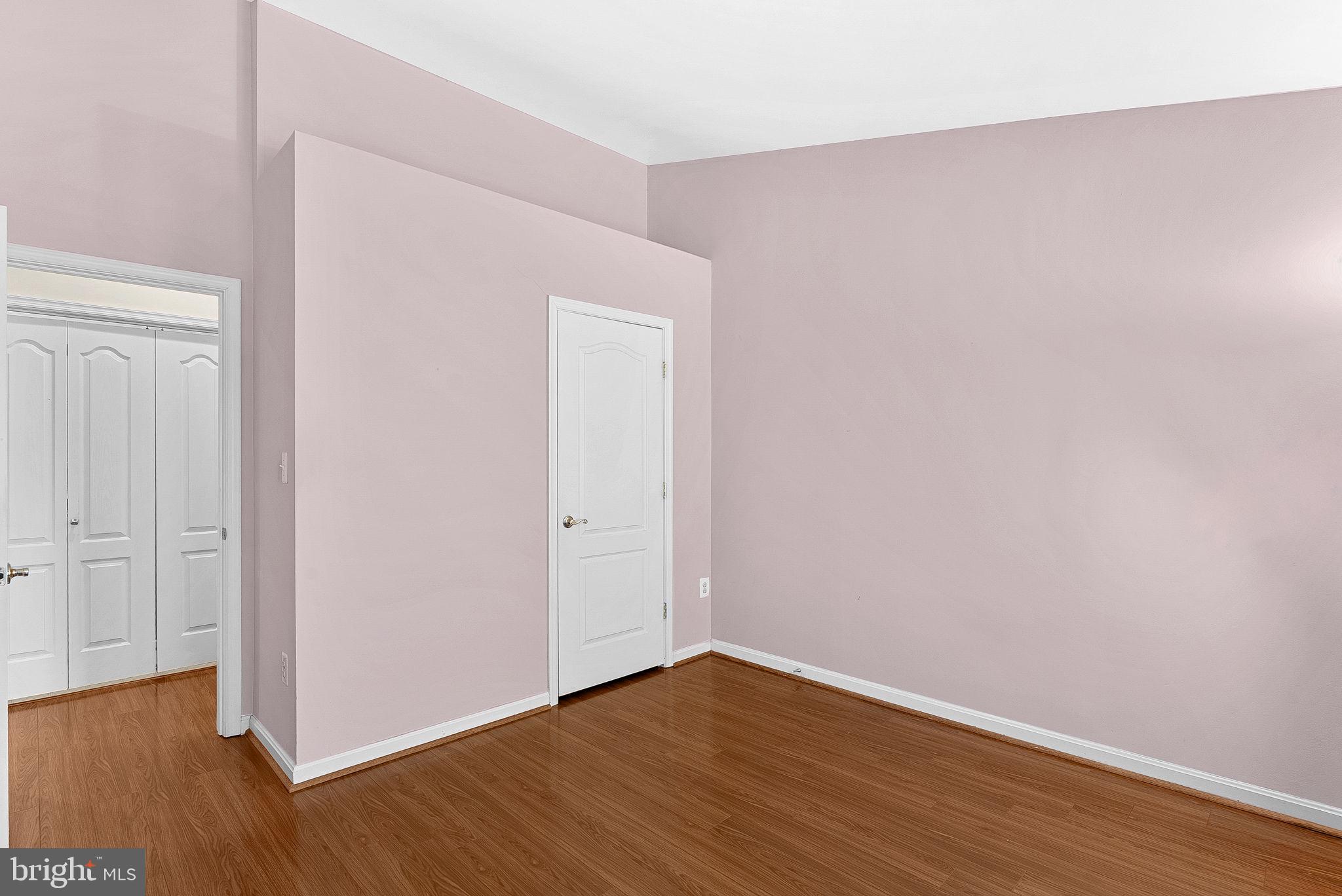 13574 Big Boulder Road Herndon, VA 20171 - Photo 40 of 45 a view of an empty room with wooden floor