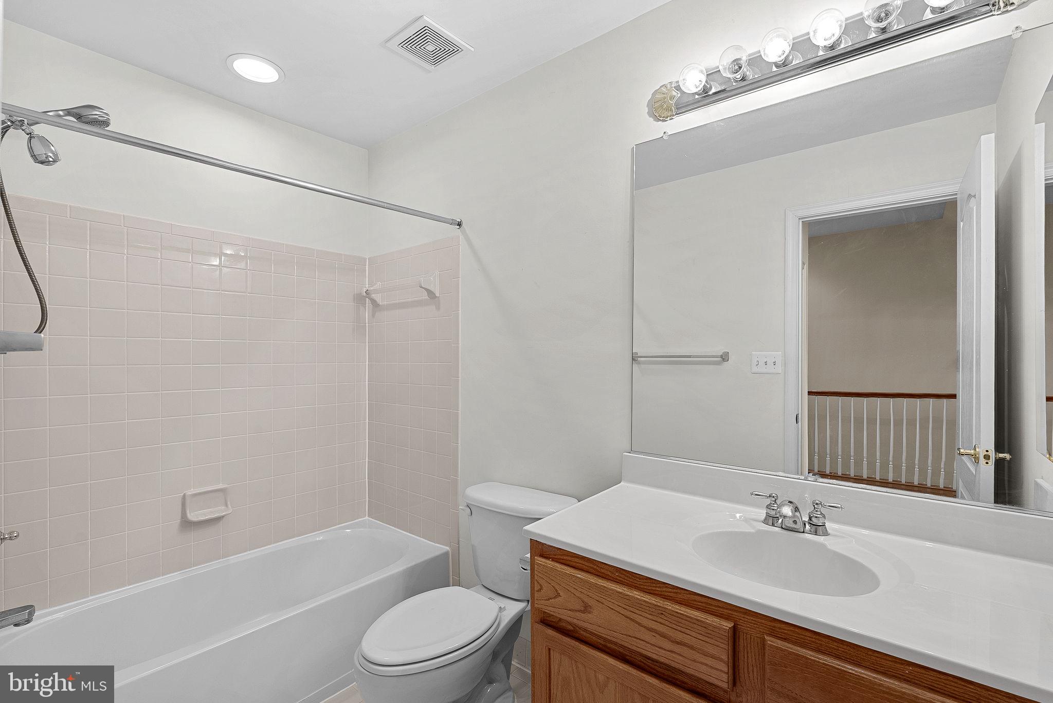 13574 Big Boulder Road Herndon, VA 20171 - Photo 41 of 45 a bathroom with a sink toilet and shower